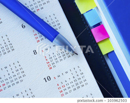 Files and calendars on the table 103962503