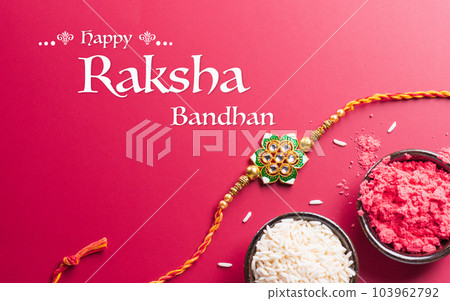 Raksha Bandhan, Indian festival with beautiful Rakhi and Rice Grains. A traditional Indian wrist band which is a symbol of love between Sisters and Brothers 103962792