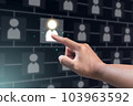 Recruitment concept. Human Resource Manager chooses new people to join an organization or support a cause. The man uses AI hologram to find a best person. 103963592