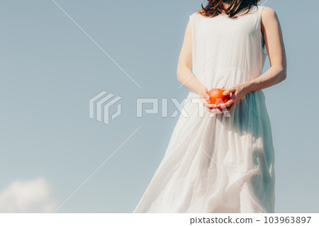 A woman with an apple 103963897