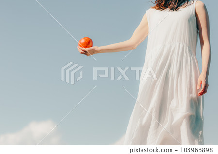 A woman with an apple 103963898