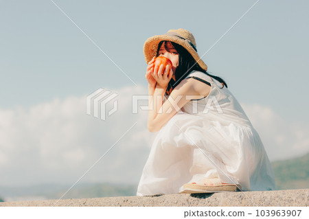 A woman with an apple 103963907