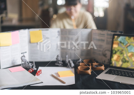 Blur background defocus of role playing tabletop and board games hobby Blur background defocus of role playing tabletop and board games hobby 103965001