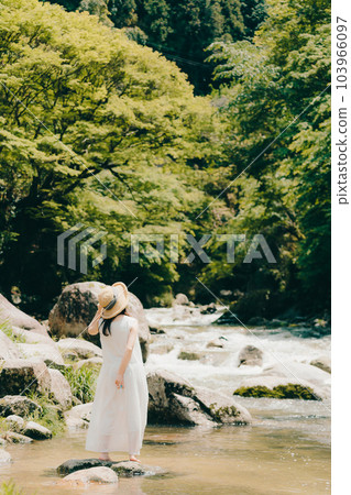 Photo of a woman in a river 103966097