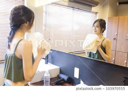 Sauna girls preparing to enter the sauna in the locker room 103970555