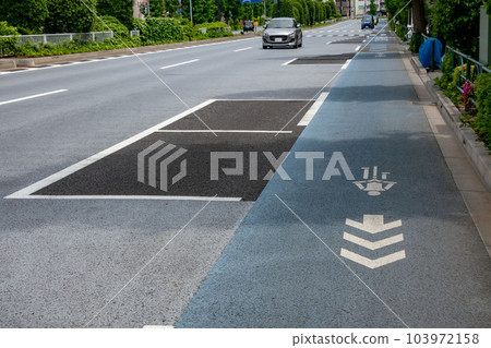 Bicycle lanes and on-street coin parking Bicycle lanes and on-street coin parking 103972158