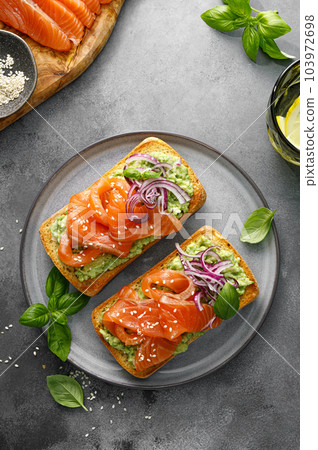 Sandwiches with salted salmon. Healthy food, breakfast. Top view 103972698