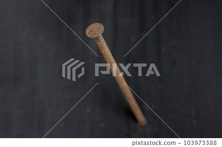 rusty nails in the wall 103973388