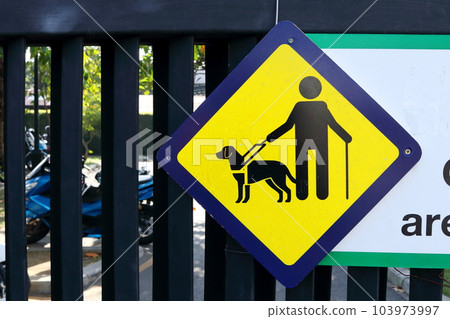 Blind man and dog sign. Blind man and dog sign. 103973997