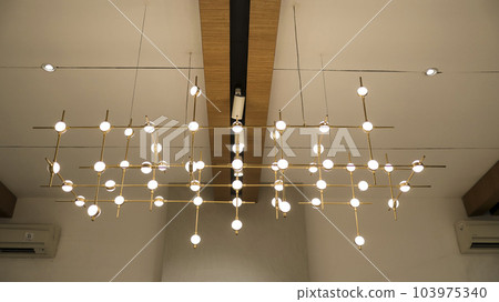 Modern artistic abstract futuristic hanging lamp beautiful interior decoration. 103975340