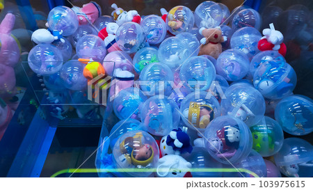 Crane Claw machine arcade price various colorful cute doll. 103975615