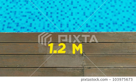 Deck of swimming pool edge 1.2 meter deep sign. 103975673