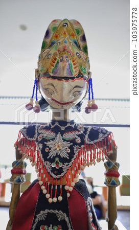 Indonesian authentic wayang golek, wooden carved rod puppet. Indonesian authentic wayang golek, wooden carved rod puppet. 103975778
