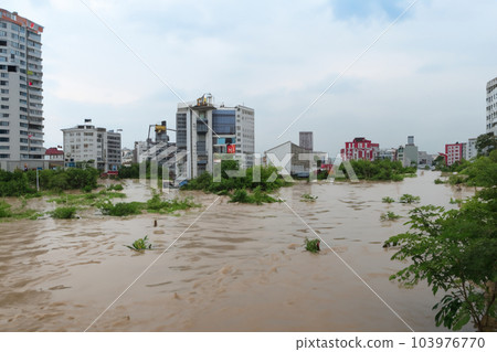 Flash flood. Torrential rains that fill the rivers and roads instantly causing flooding. Rain concept. Torrential rain. Floods. 103976770
