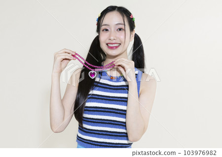 vintage y2k pink retro concept photo of korean asian cute woman wearing a necklace vintage y2k pink retro concept photo of korean asian cute woman wearing a necklace 103976982