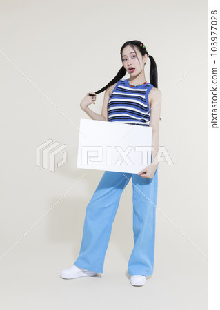 vintage y2k pink retro concept photo of korean asian cute woman holding a frame panel 103977028