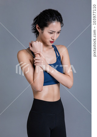 healthy beauty concept photo of korean asian beautiful woman feeling wrist pain 103977110