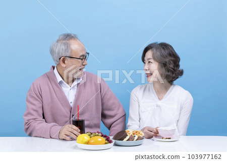active young senior korean asian couple having teatime 103977162