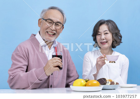 active young senior korean asian couple having teatime active young senior korean asian couple having teatime 103977257