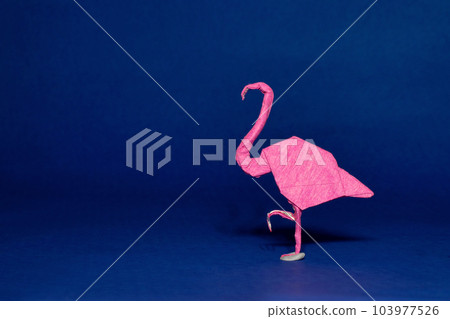 Origami of a Flamingo against a blue background 103977526
