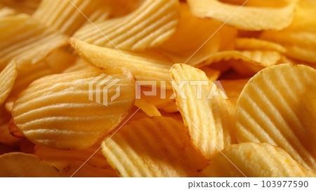 Delicious crispy potato chips, famous snack, fat food, wallpaper, texture, for banner, flyer Delicious crispy potato chips, famous snack, fat food, wallpaper, texture, for banner, flyer 103977590