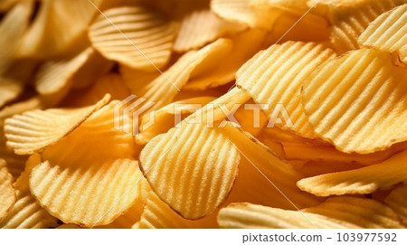 Delicious crispy potato chips, famous snack, fat food, wallpaper, texture, for banner, flyer 103977592
