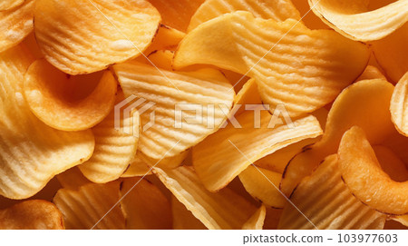 Delicious crispy potato chips, famous snack, fat food, wallpaper, texture, for banner, flyer 103977603