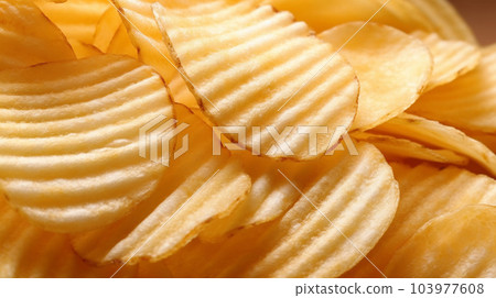 Delicious crispy potato chips, famous snack, fat food, wallpaper, texture, for banner, flyer Delicious crispy potato chips, famous snack, fat food, wallpaper, texture, for banner, flyer 103977608