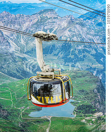 TITLIS Rotair cable car rotates its way up towards the snow-covered summit of TITLIS, Switzerland TITLIS Rotair cable car rotates its way up towards the snow-covered summit of TITLIS, Switzerland 103978090