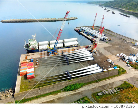 Photographing the scenery of unloading wind turbine parts from a cargo ship at Esashi Port in Esashi Town, Hokkaido in early summer Photographing the scenery of unloading wind turbine parts from a cargo ship at Esashi Port in Esashi Town, Hokkaido in early summer 103978180