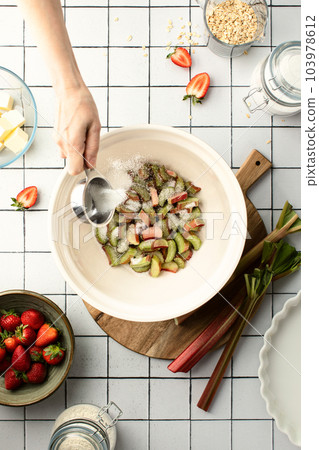Rhubarb cobbler baking, top down view of ingredients according to a recipe 103978612