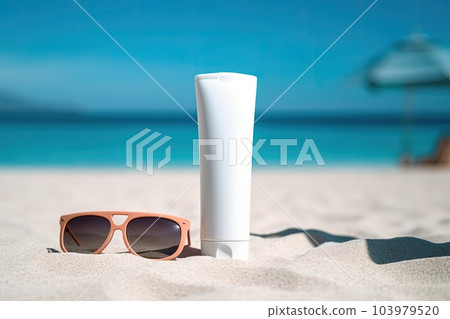 Sunscreen on sandy beach with sunglasses 103979520