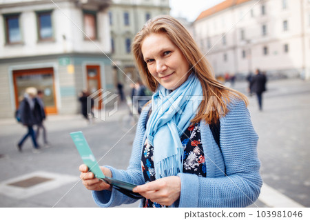 Beautiful woman having fun traveling outdoors during vacation in Europe. Lifestyle, travel concept. Beautiful woman having fun traveling outdoors during vacation in Europe. Lifestyle, travel concept. 103981046