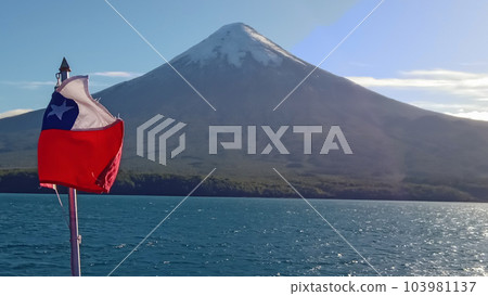 Chilean flag with Osorno volcano on back, in Puerto Varas, south of Chile 103981137