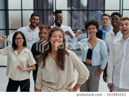 Multiethnic young business people working together in the office Multiethnic young business people working together in the office 103984281