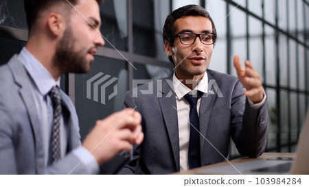 Business Having Meeting Around Table In Modern Office Business Having Meeting Around Table In Modern Office 103984284
