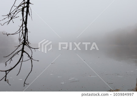 Fishermen on the ice, heavy fog, early spring, lonely Fishermen on the ice, heavy fog, early spring, lonely 103984997