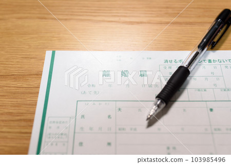 How to write a divorce notice A man writing with a ballpoint pen 103985496