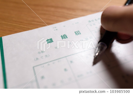 How to write a divorce notice A man writing with a ballpoint pen 103985500