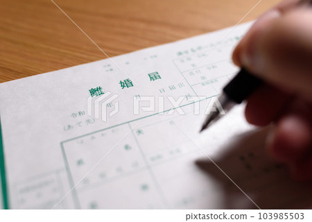 How to write a divorce notice A man writing with a ballpoint pen 103985503