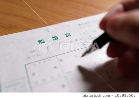 How to write a divorce notice A man writing with a ballpoint pen 103985505