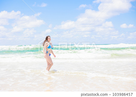 Caucasian girl frolic in the sea Caucasian girl frolic in the sea 103986457