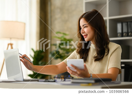 Charming female analyst checking marketing research results or statistics data on laptop computer Charming female analyst checking marketing research results or statistics data on laptop computer 103986566