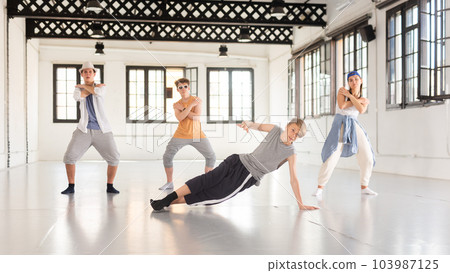 Teenage dancers having break dance training at studio Teenage dancers having break dance training at studio 103987125