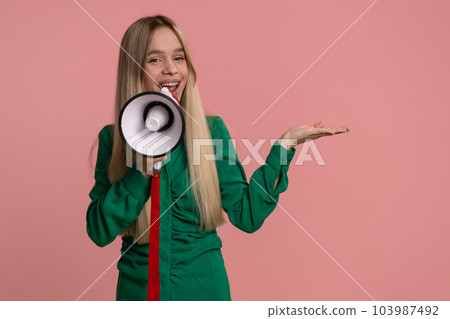 Woman scream in megaphone announces discounts sale, pointing empty advertising area banner logo 103987492