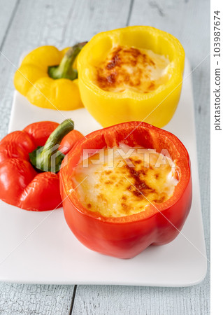 Stuffed red peppers 103987674