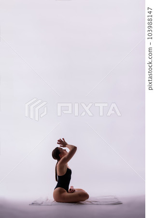 Beautiful woman doing poses on yoga class. Studio shot. Beautiful woman doing poses on yoga class. Studio shot. 103988147