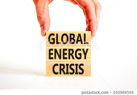 Global energy crisis symbol. Concept words Global energy crisis on wooden blocks. Businessman hand. Beautiful white table white background. Business and global energy crisis concept. Copy space. 103988595