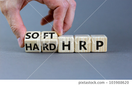 HRP, human resource planning symbol. Businessman turns wooden cubes and changes words hard HRP to soft HRP. Beautiful grey background. Business, HRP, human resource planning concept. Copy space. HRP, human resource planning symbol. Businessman turns wooden cubes and changes words hard HRP to soft HRP. Beautiful grey background. Business, HRP, human resource planning concept. Copy space. 103988620