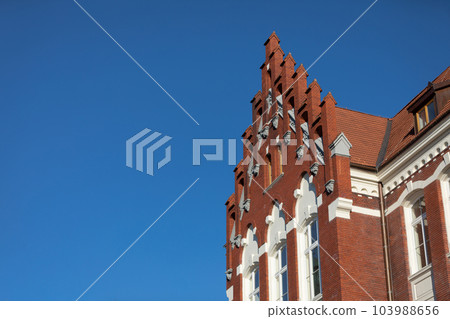 The gable and curtain wall culmination seen from below in full sunlight. 103988656